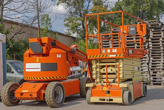 forklift carrying pallets in a busy warehouse in Canyon Lake